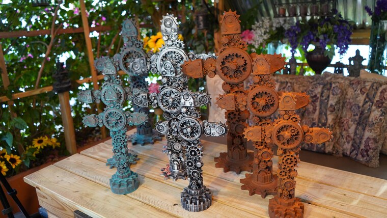 A lineup of finished gear crosses in the garden studio
